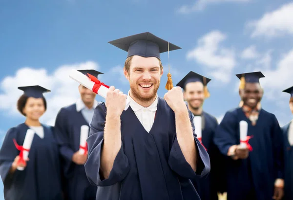 Happy student s diplomem oslavu promoce Royalty Free Stock Obrázky