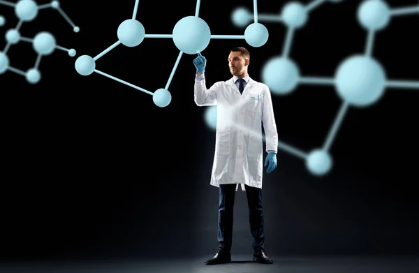 Scientifique en blouse de laboratoire avec des molécules — Photo