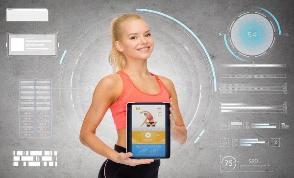 Sportowy kobieta z aplikacji fitness na komputerze typu tablet — Zdjęcie stockowe