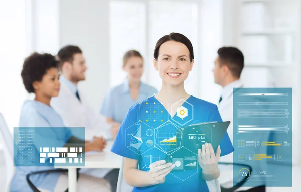 Happy doctor over group of medics at hospital — Stock Photo, Image