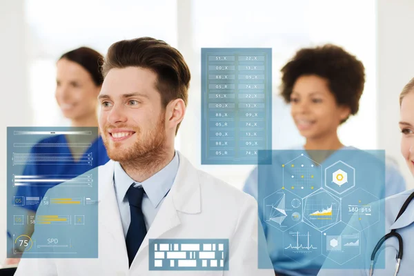 Happy doctor over group of medics at hospital — Stock Photo, Image