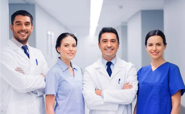 Happy group of medics or doctors at hospital — Stock Photo, Image