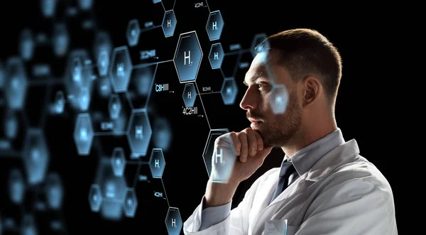Scientist looking at chemical formula projection — Stock Photo, Image