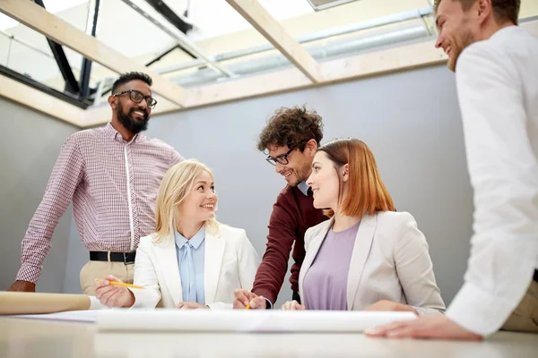 Business team with blueprint project at office — Stock Photo, Image