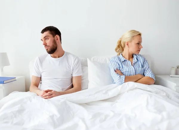 Unhappy couple having conflict in bed at home — Stock Photo, Image