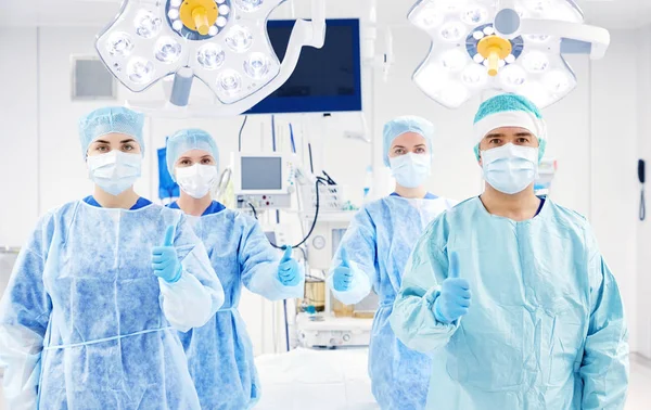 Group of surgeons in operating room at hospital — Stock Photo, Image