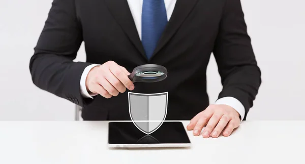 Businessman with tablet pc antivirus program icon — Stock Photo, Image