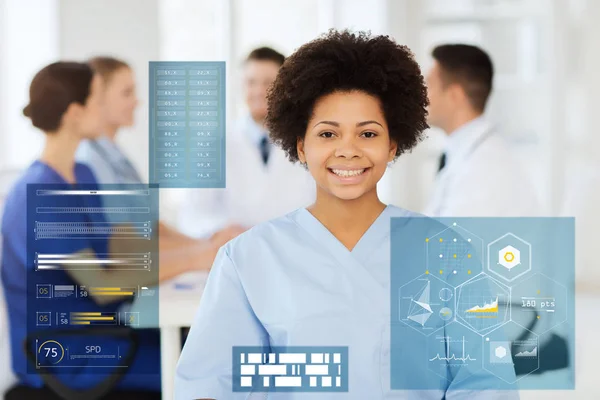 Happy african american female doctor at hospital — Stock Photo, Image