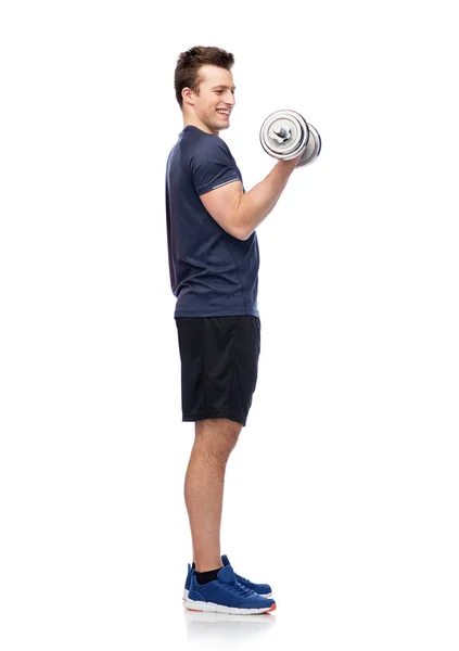 Sportive man flexing muscles with dumbbell — Stock Photo, Image