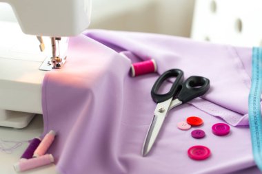 sewing machine, scissors, buttons and fabric clipart