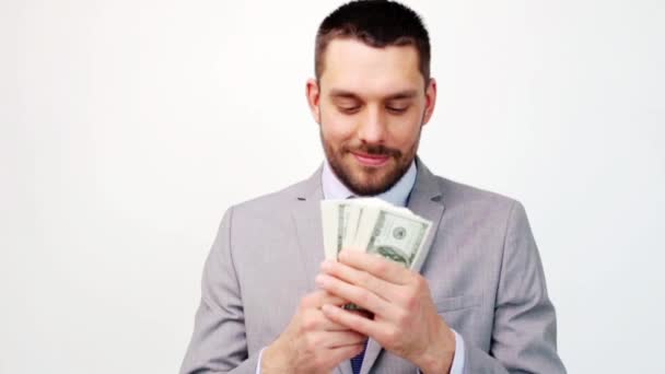 Hombre de negocios feliz con mucho dinero en dólares — Vídeo de stock