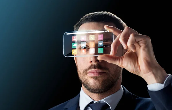 Geschäftsmann mit transparentem Smartphone — Stockfoto