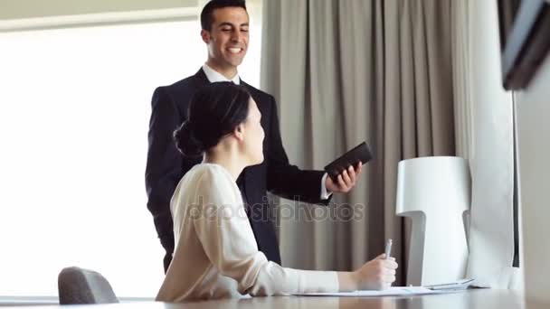 Business team with papers and tablet pc at hotel — Stock Video
