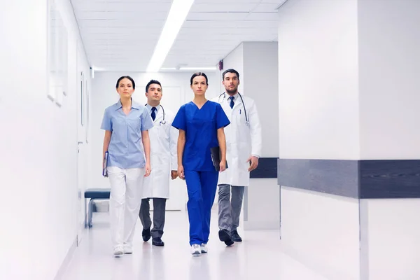 Group of medics or doctors at hospital corridor — Stock Photo, Image
