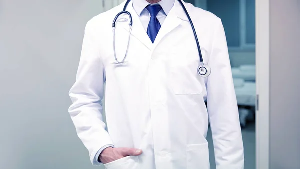 Close up of doctor with stethoscope at hospital — Stock Photo, Image