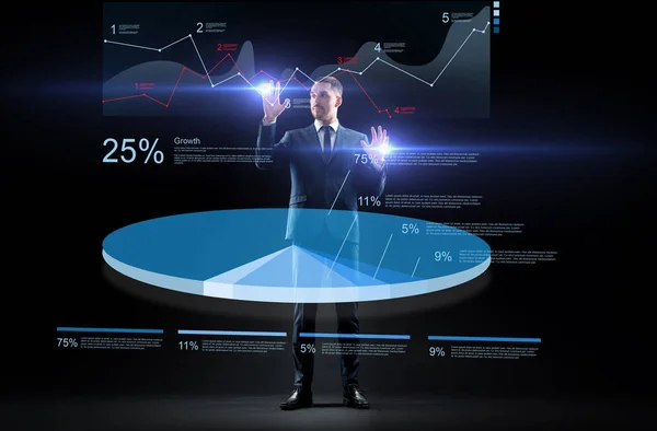 仮想の円グラフの操作のスーツのビジネスマン — ストック写真