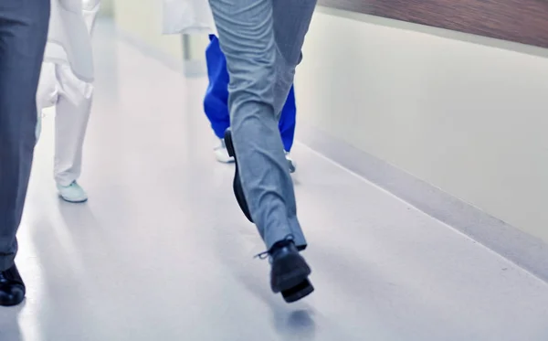 Close up of medics or doctors running at hospital — Stock Photo, Image