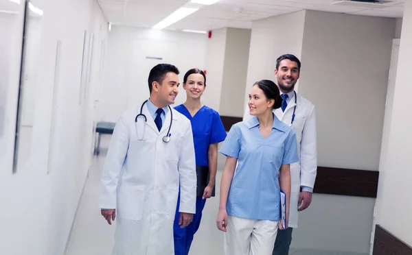 Group of happy medics or doctors at hospital — Stock Photo, Image