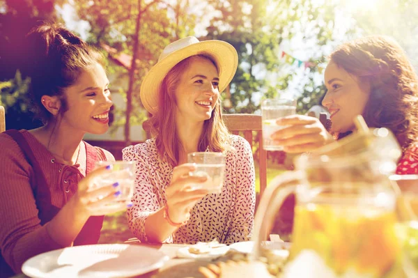 Happy friends having party at summer garden — Stock Photo, Image