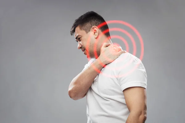 Homem infeliz sofrendo de dor no pescoço Imagem De Stock