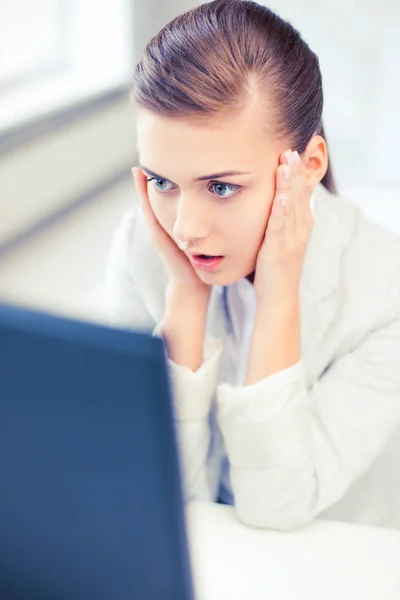 Stressed businesswoman with computer — Stock Photo, Image