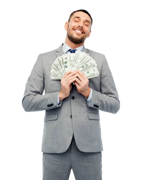 Homem de negócios sorridente com dinheiro do dólar americano — Fotografia de Stock