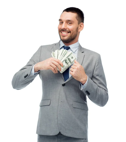 Sonriente hombre de negocios con dinero del dólar americano — Foto de Stock