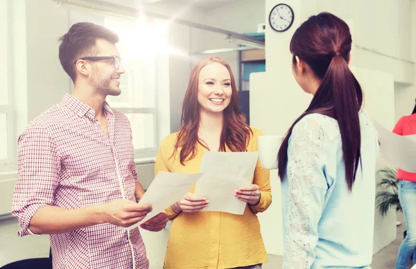 Creative team on coffee break talking at office — Stock Photo, Image