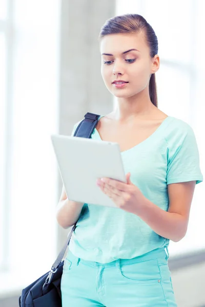 Smiling student with tablet pc in college — Stock Photo, Image