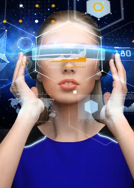 Woman in virtual reality 3d glasses with charts — Stock Photo, Image