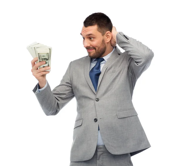 Homem de negócios sorridente com dinheiro do dólar americano — Fotografia de Stock