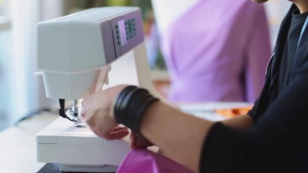 Fashion designer with sewing machine working — Stock Video