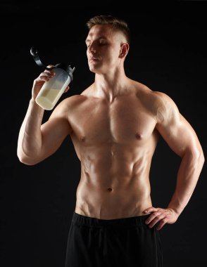 young man or bodybuilder with protein shake bottle clipart