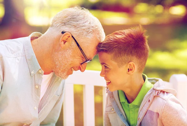 Grandfather and grandson at summer park — Stock Photo, Image