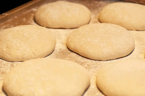 Yeast bread dough on bakery kitchen table — Stock Photo, Image