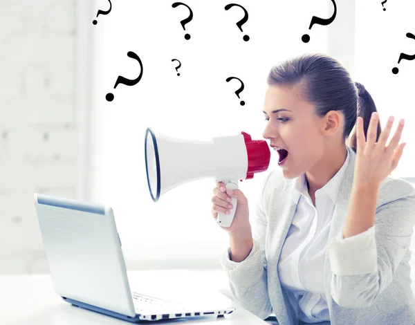 Strict businesswoman shouting in megaphone — Stock Photo, Image