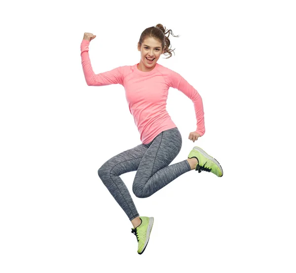 Felice sorridente sportiva giovane donna che salta in aria — Foto Stock
