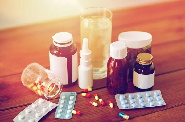 Medicine and drugs on wooden table — Stock Photo, Image