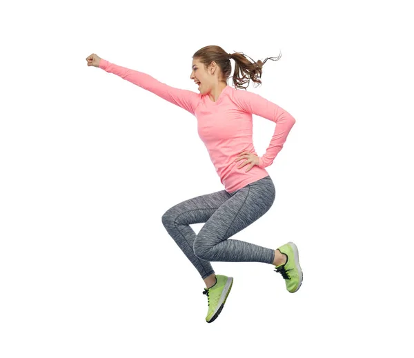 Feliz sonriente joven deportista saltando en el aire — Foto de Stock