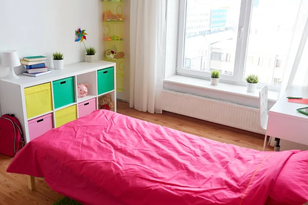 Kids room interior with bed, rack and accessories — Stock Photo, Image