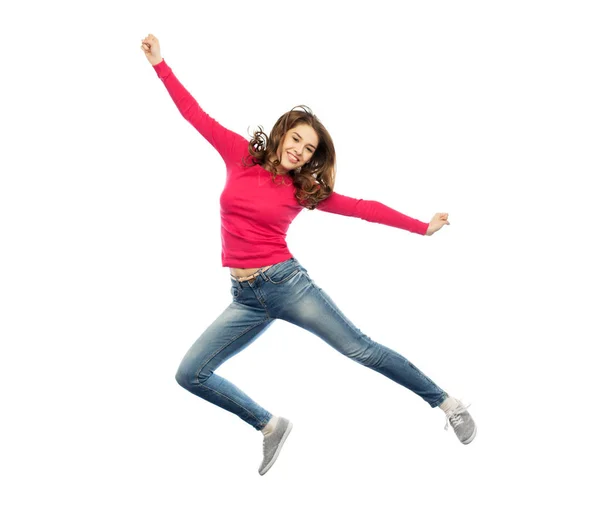 Souriant jeune femme sautant dans l'air — Photo