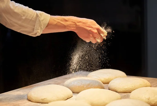 Chef or baker making bread dough at bakery — Stock Photo, Image