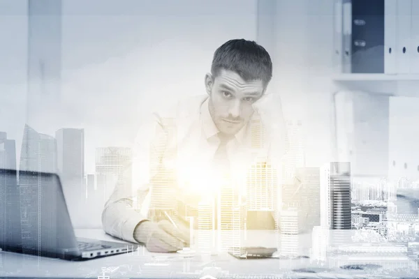 Stressed businessman with laptop at office — Stock Photo, Image