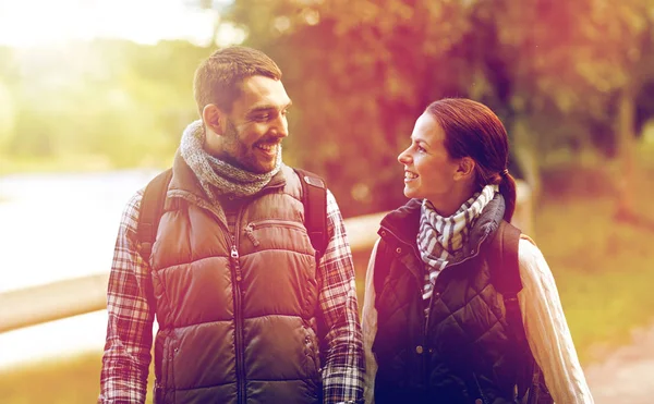 Happy family walking with backpacks in woods — Stock Photo, Image