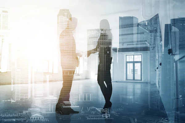 Business people shaking hands over city background — Stock Photo, Image