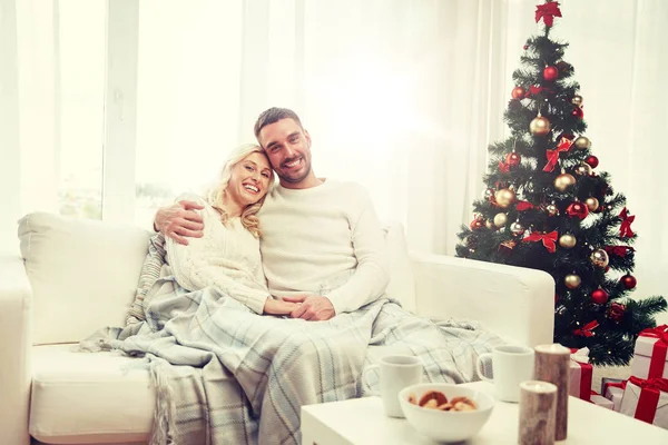 Happy couple at home with christmas tree — Stock Photo, Image