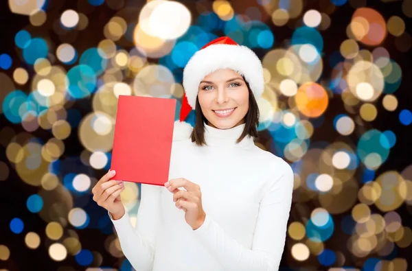 Glückliche Frau mit Weihnachtsgrußkarte — Stockfoto