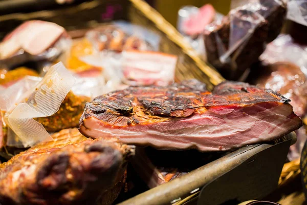 Smoked meat products at market or butcher shop — Stock Photo, Image