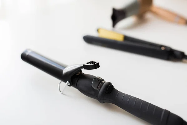 Curling iron, hot styler and hairdryer — Stock Photo, Image
