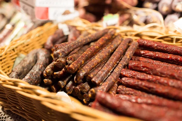 Smoked meat products at market or butcher shop — Stock Photo, Image